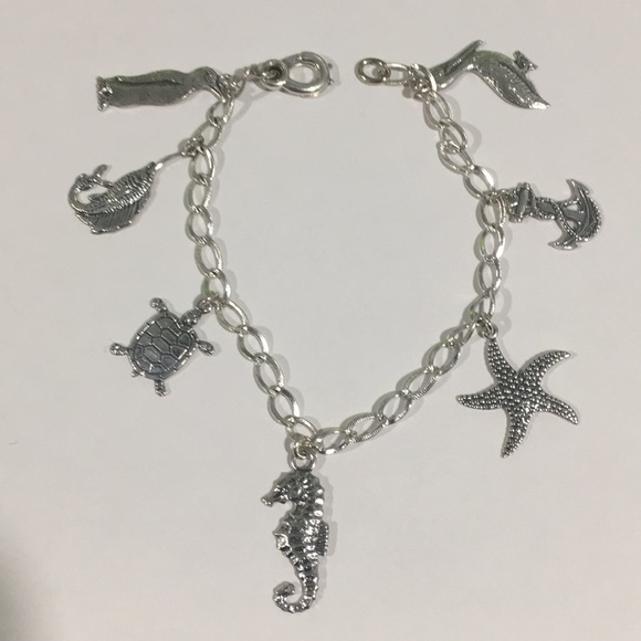 Sterling Silver Bracelet With 7 Different Charms - Picture 3 of 7